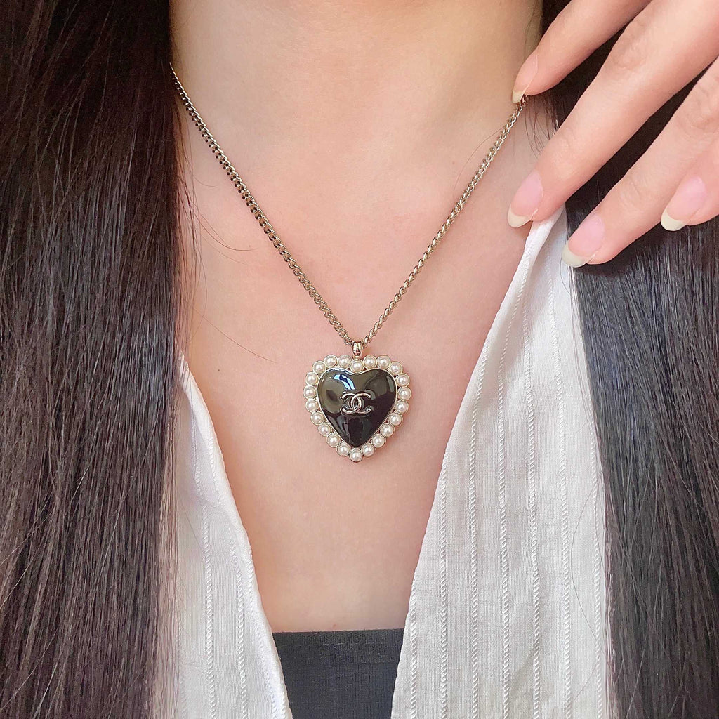 Chanel Interlocking C Pearl Heart Necklace - album image 1