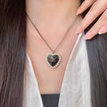 Chanel Interlocking C Pearl Heart Necklace - album image 1
