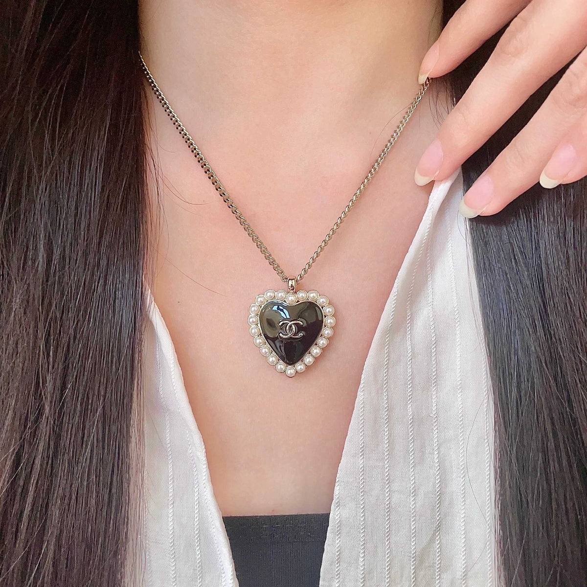 Chanel Interlocking C Pearl Heart Necklace - album image 1