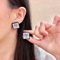 Chanel Interlocking C Stud Earrings - album image 1