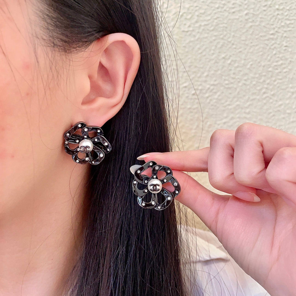 Chanel Interlocking C Camellia Openwork Stud Earrings - album image 1