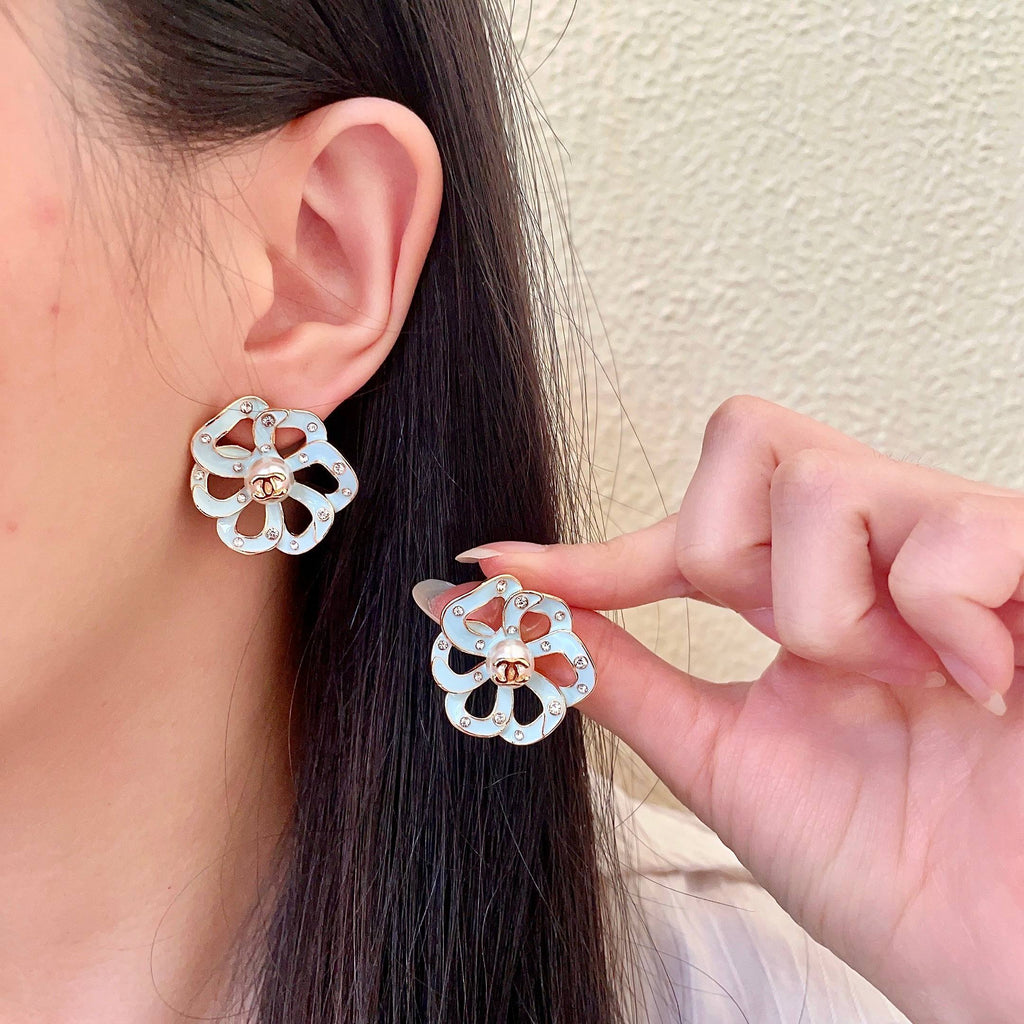 Chanel Interlocking C Camellia Openwork Stud Earrings - album image 1