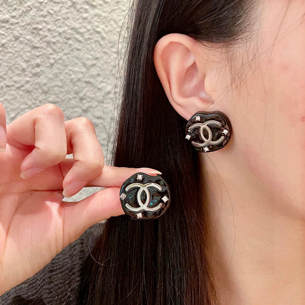 Chanel Interlocking C Stud Earrings - album image 1