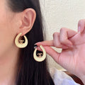 Chanel Interlocking C Stud Earrings - album image 1