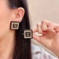 Chanel Interlocking C Stud Earrings - album image 1
