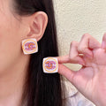 Chanel Interlocking C Stud Earrings - album image 1