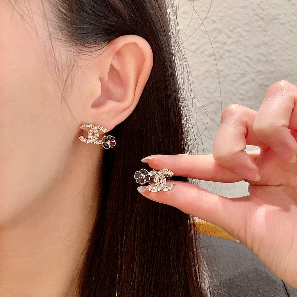 Chanel Interlocking C Camellia Stud Earrings - album image 1