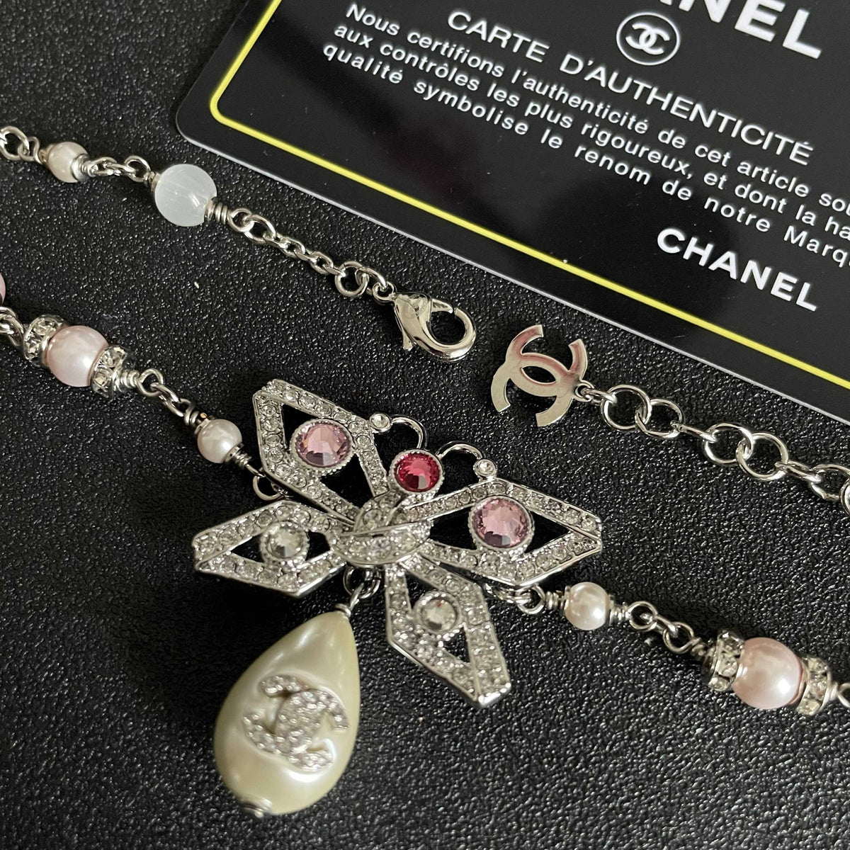 Chanel Interlocking C Bow Butterfly Pearl Crystal Accent Necklace - album image 7
