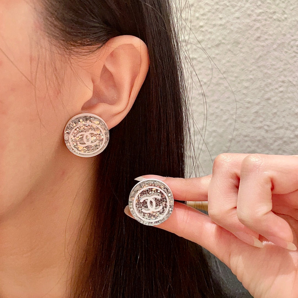 Chanel Interlocking C Stud Earrings - album image 1