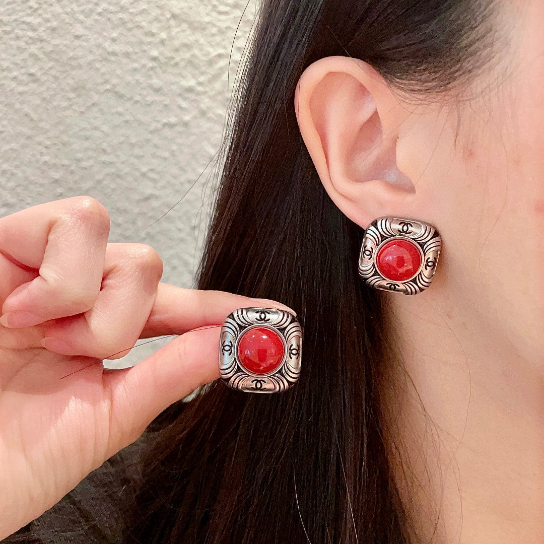 Chanel Interlocking C Stud Earrings - album image 1