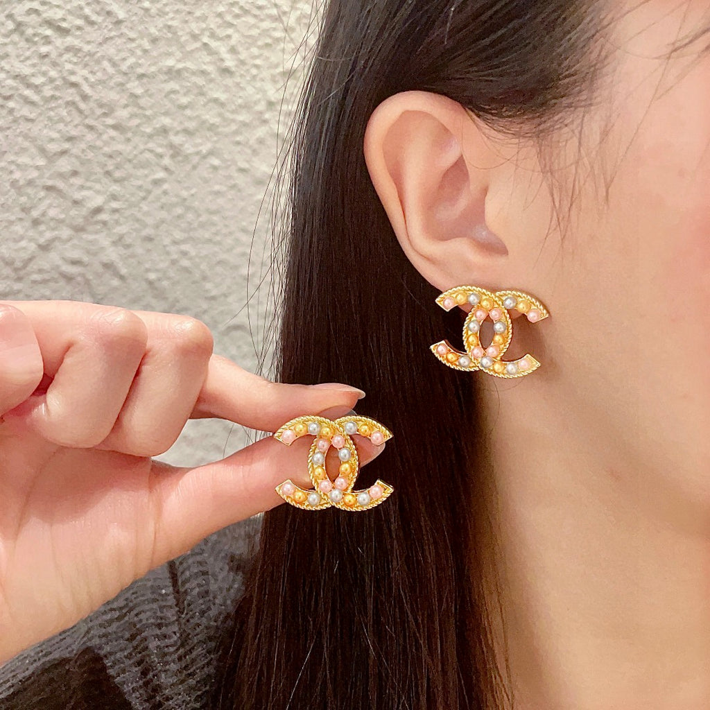 Chanel Interlocking C Stud Earrings - album image 1