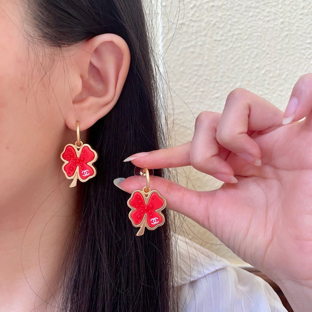 Chanel Interlocking C Camellia Earrings - album image 1