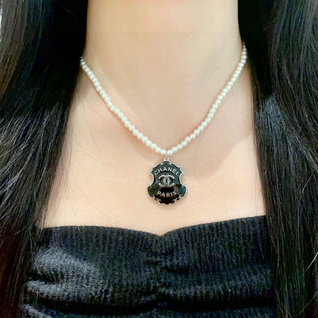 Chanel Interlocking C Pearl Letter Necklace - album image 3