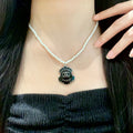 Chanel Interlocking C Pearl Letter Necklace - album image 1
