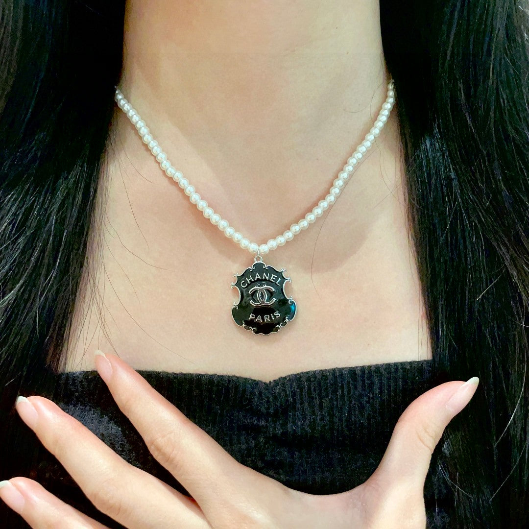 Chanel Interlocking C Pearl Letter Necklace - album image 2