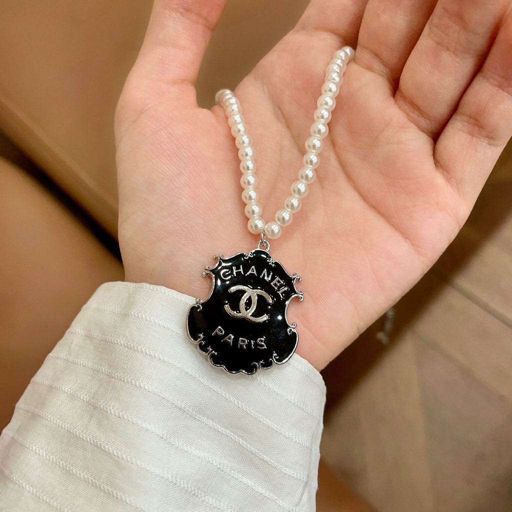 Chanel Interlocking C Pearl Letter Necklace - album image 4