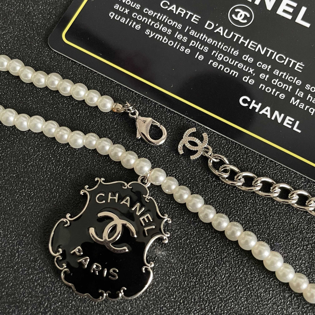 Chanel Interlocking C Pearl Letter Necklace - album image 7