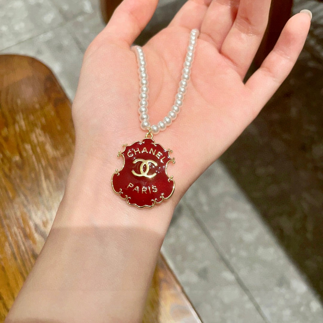 Chanel Interlocking C Pearl Letter Necklace - album image 4