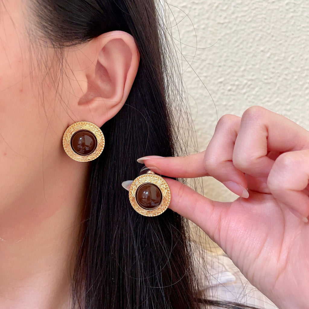 Chanel Interlocking C Stud Earrings - album image 1