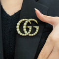Gucci Gold-Tone Crystal Interlocking G Brooch - album image 1