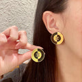 Chanel Interlocking C Stud Earrings - album image 1
