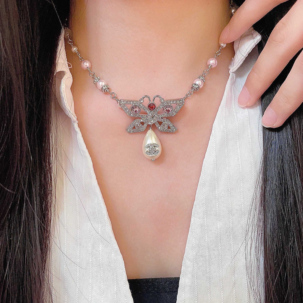Chanel Interlocking C Bow Butterfly Pearl Crystal Accent Necklace - album image 1