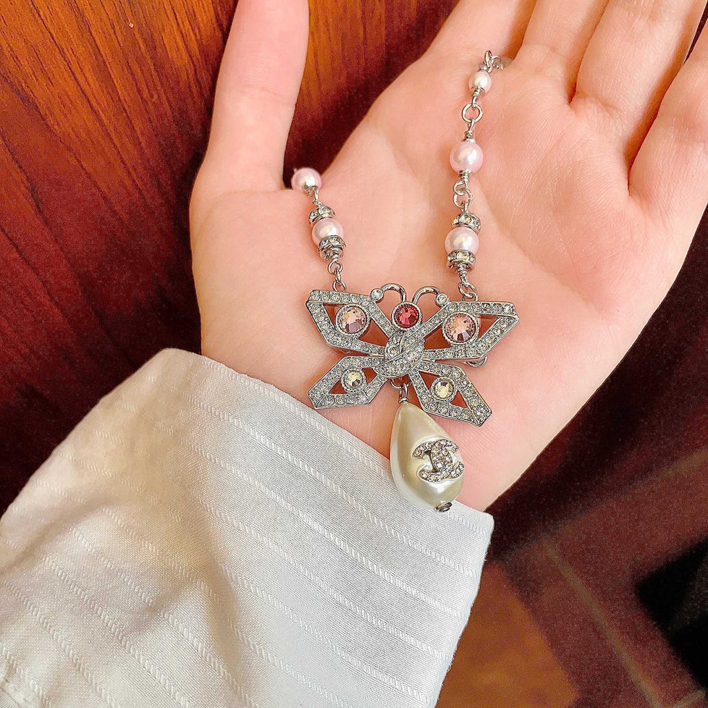 Chanel Interlocking C Bow Butterfly Pearl Crystal Accent Necklace - album image 4