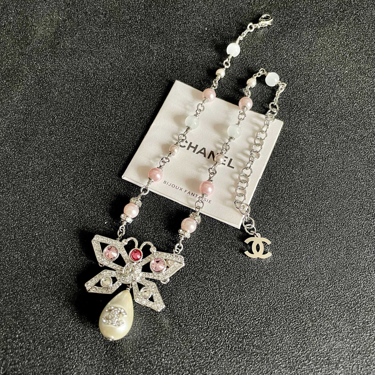 Chanel Interlocking C Bow Butterfly Pearl Crystal Accent Necklace - album image 9