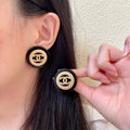 Chanel Interlocking C Stud Earrings - album image 1