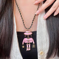 Chanel Pink Doll Pendant Necklace - album image 1