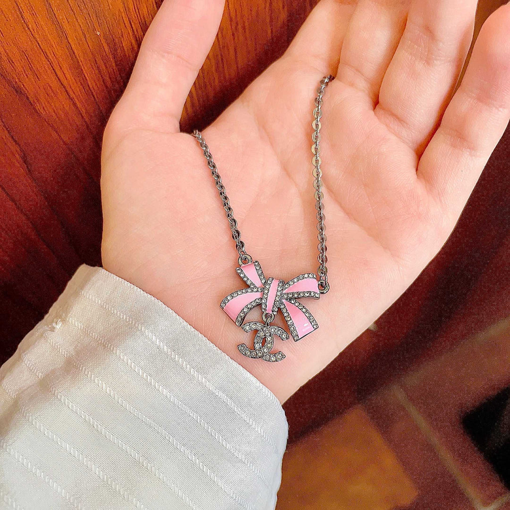 Chanel Interlocking C Bow Butterfly Crystal Accent Necklace - album image 4