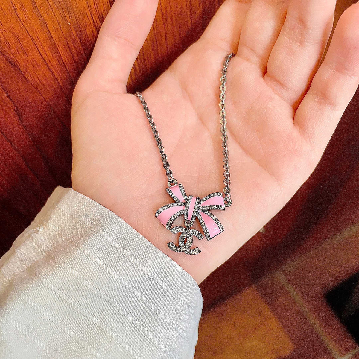 Chanel Interlocking C Bow Butterfly Crystal Accent Necklace - album image 4