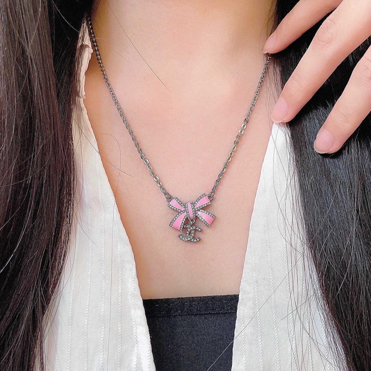 Chanel Interlocking C Bow Butterfly Crystal Accent Necklace - album image 1
