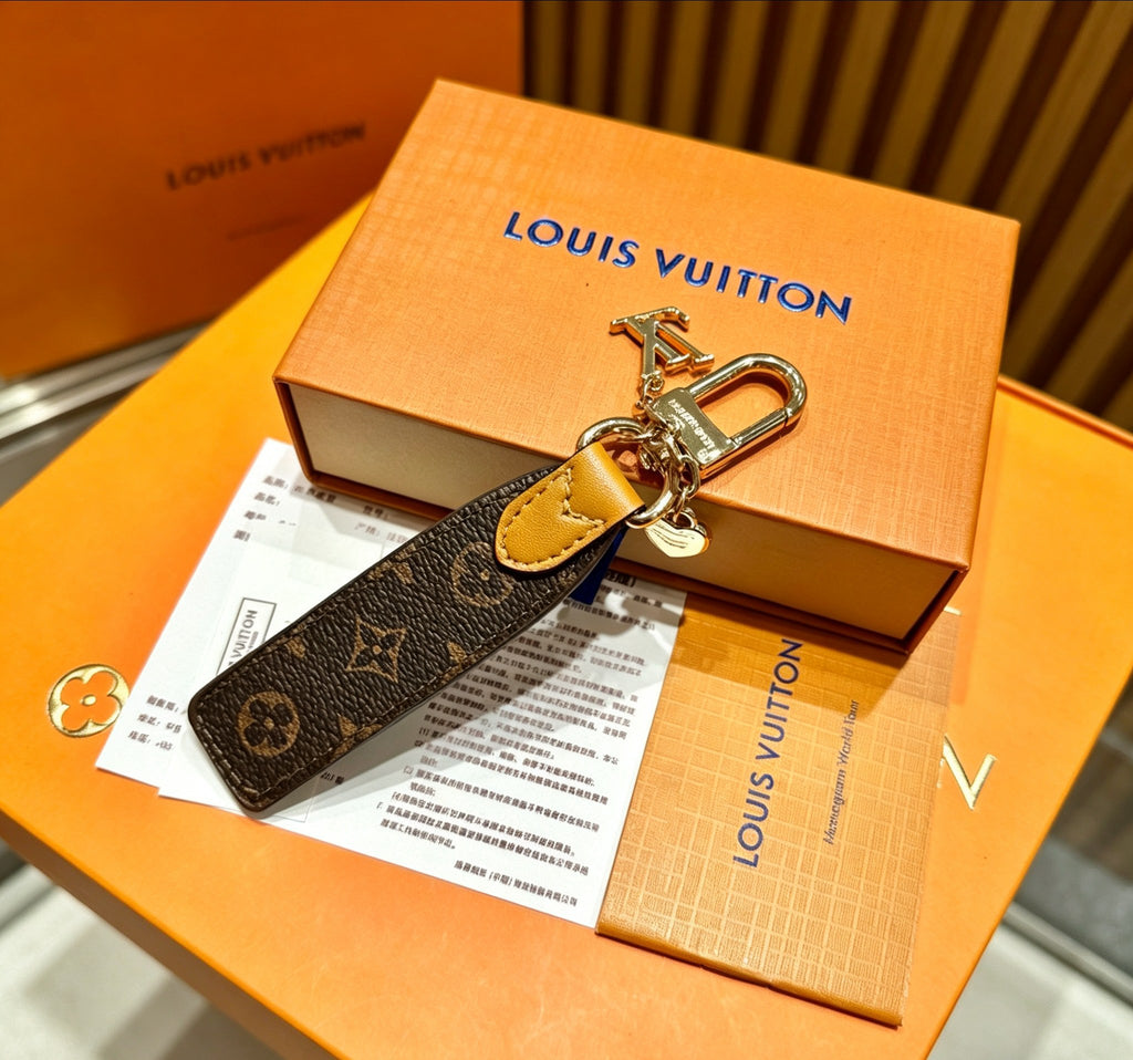 Louis Vuitton Key Silver-Tone Monogram V Letter Letter Keychain - album image 2