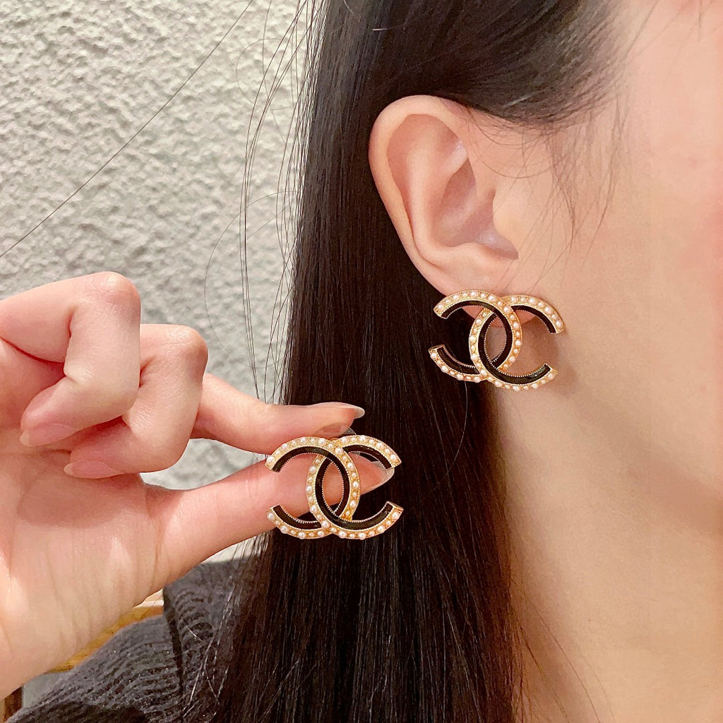 Chanel Interlocking C Pearl Stud Earrings - album image 1