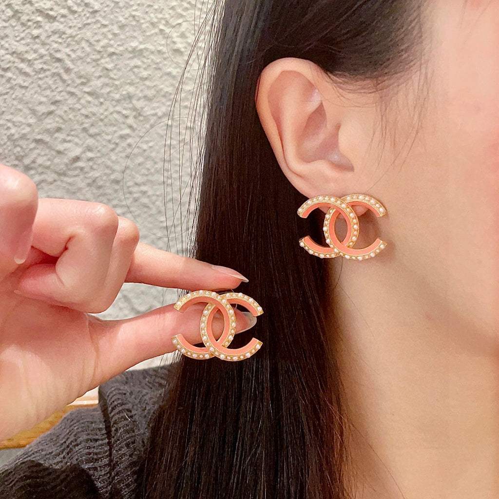 Chanel Interlocking C Pearl Stud Earrings - album image 1