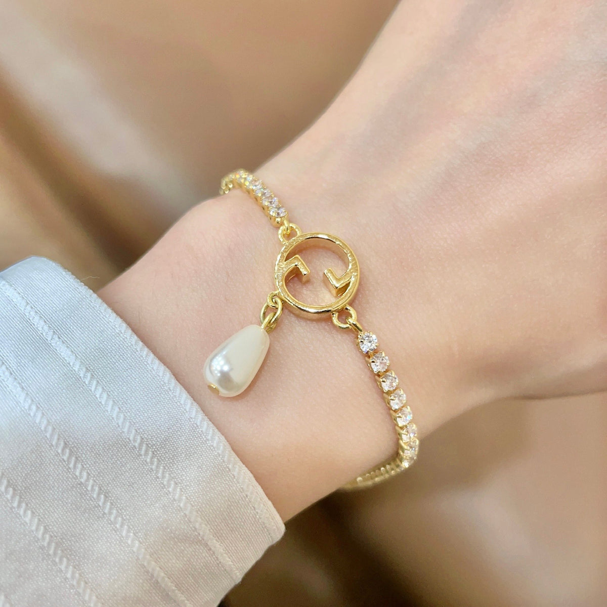 Gucci Gold-Tone G Charm Bracelet with Teardrop Accent - album image 1
