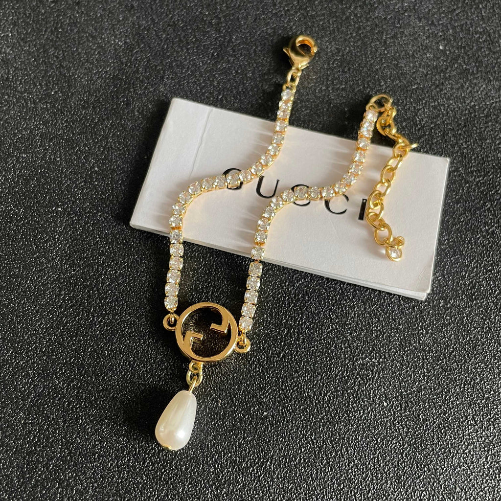 Gucci Gold-Tone G Charm Bracelet with Teardrop Accent - album image 8