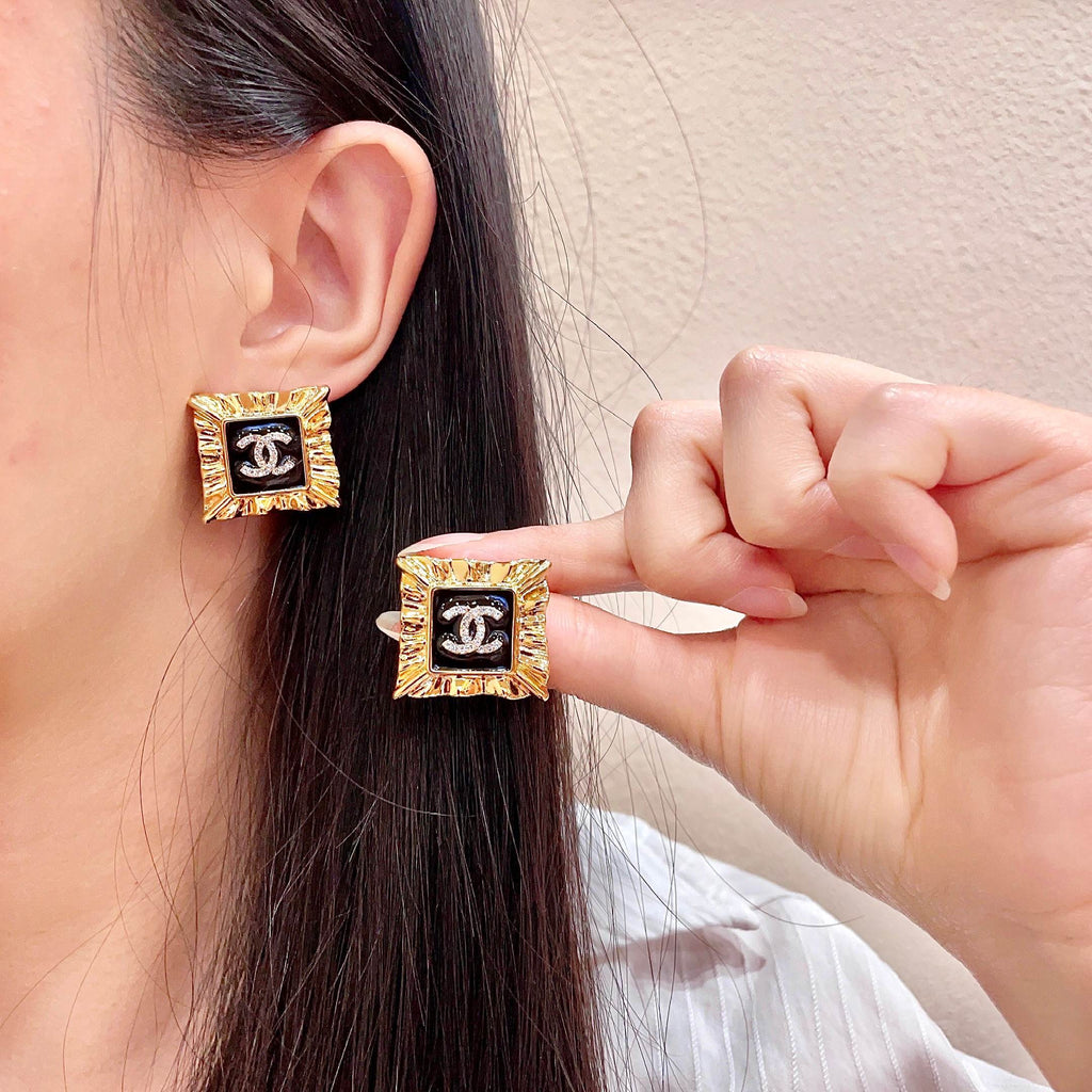 Chanel Interlocking C Stud Earrings - album image 1