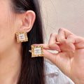 Chanel Interlocking C Stud Earrings - album image 1