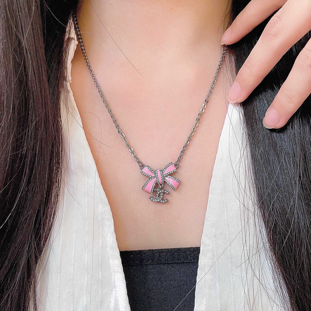 Chanel Interlocking C Bow Butterfly Crystal Accent Necklace - album image 1