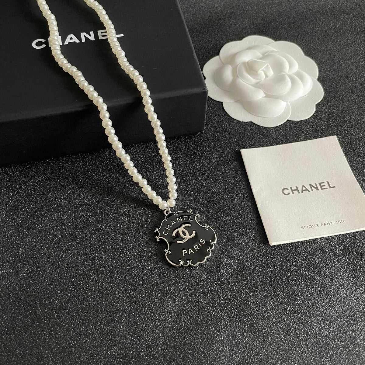 Chanel Interlocking C Pearl Letter Necklace - album image 6