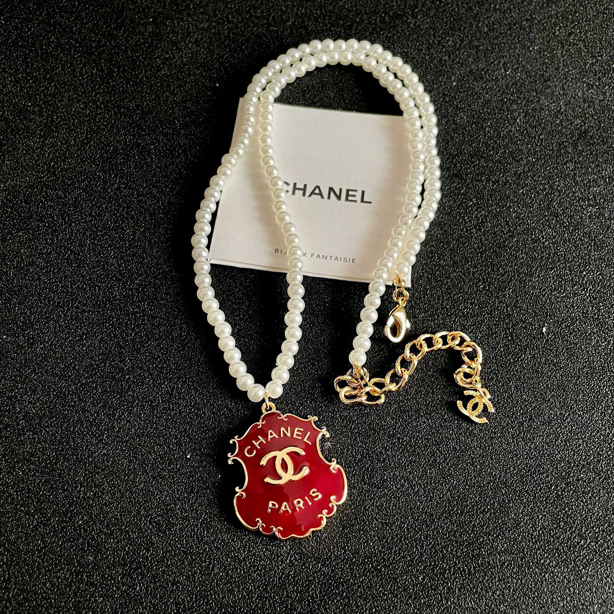 Chanel Interlocking C Pearl Letter Necklace - album image 9