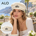 Alo Woven Open Knit Beret worn by a model