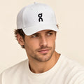 Model wearing baseball cap on head