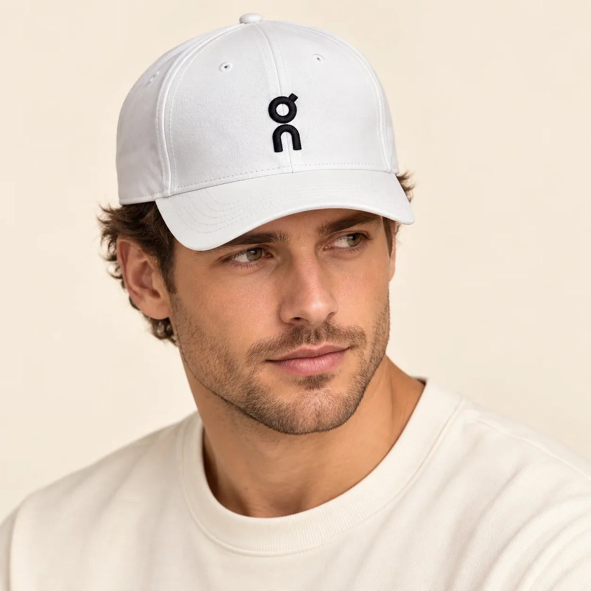 Model wearing baseball cap on head