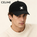 Model wearing celine baseball cap on head