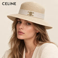 Model wearing celine straw hat on head