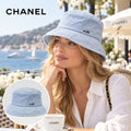 Chanel Bucket Hat worn by a model