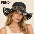 Model wearing fendi wide brim hat on head